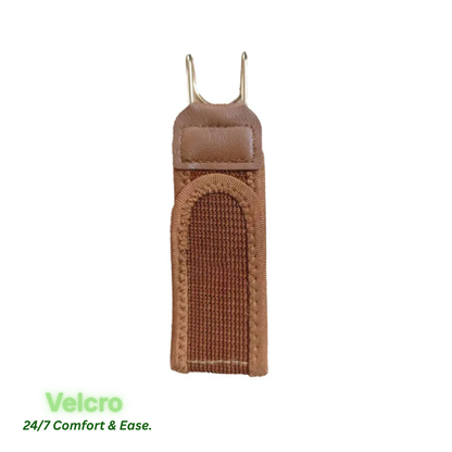 A brown leather and Velcro strap holder with metal hooks, shown on a white background with green text at the bottom left reading 'Velcro 24/7 Comfort & Ease.'.